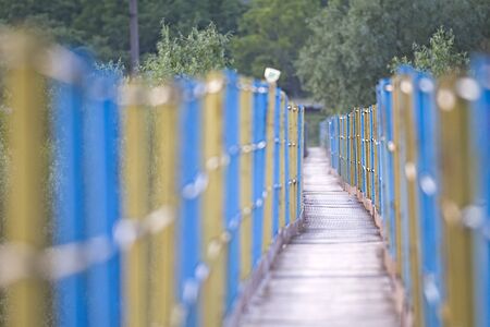 Metal pedestrian suspension bridge in Ukraineの写真素材