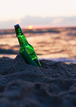 Message in the bottle washed ashore against soft waves. Dreamy ideas conceptの写真素材