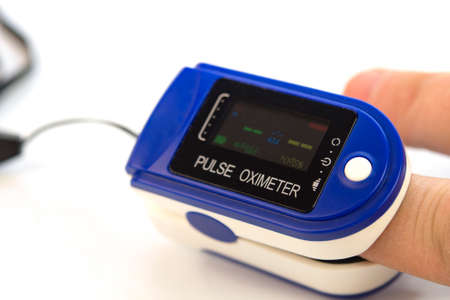 Pulse oximeter used to measure pulse rate and oxygen levelsの写真素材
