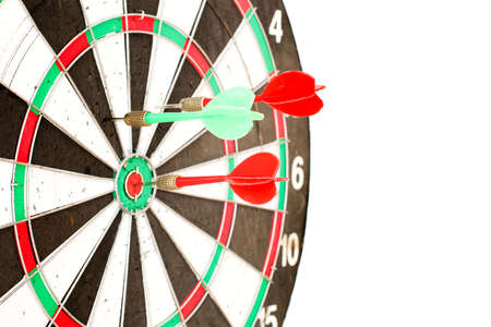 Colorful darts hitting a target, isolated on white