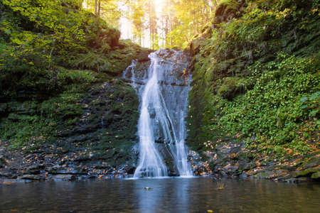 Wonderful waterfall on the mountain river Carpathians. Sopit Waterfall, Beskydy National Park,...