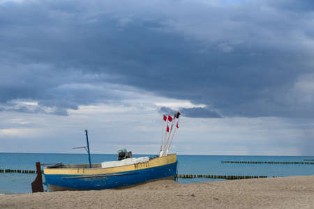 Fishing boat on the beach of the Polish Baltic coast near Rewalの写真素材