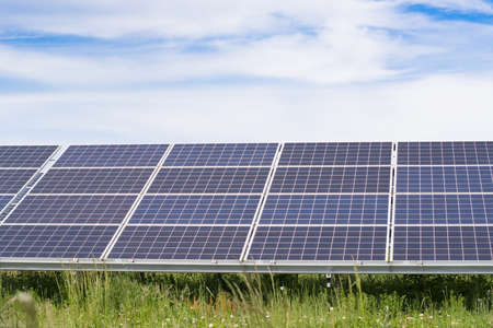 Solar panels and blue sky. Solar panels system power generators from sun. Clean technology for...
