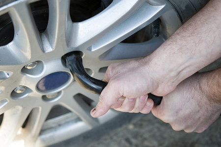 changing flat tire on the road. A close upの写真素材