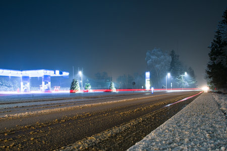 gas station and convenience store at nightの写真素材