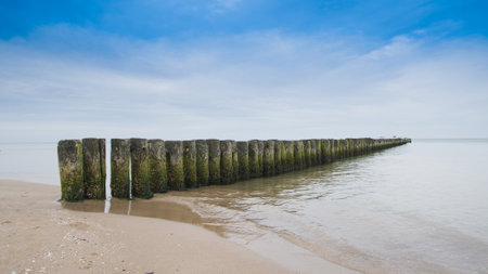 Breakwater on the beach of the Baltic Sea near Rewal. Polandの写真素材