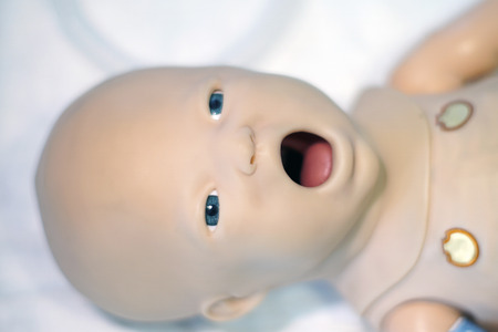 Simulation medicine model of a newborn child for examination and treatment by students or pediatricians-neonatologists.の写真素材