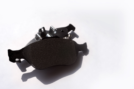 New auto brake pads on grey backgroundの写真素材