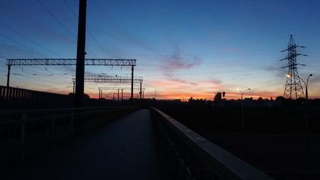 sunset at the train stop with beautiful deep blue sky and red clouds. Wideの写真素材