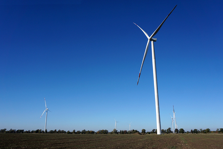 Eco power, wind turbines with blue sky. wind turbine for alternative electricity.renewable electric farm with sustainable eco-friendly technology using wind energy rotation for wind turbines renewableの写真素材