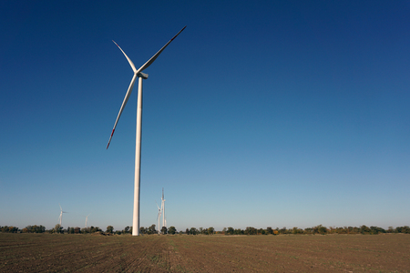 Eco power, wind turbines with blue sky. wind turbine for alternative electricity.renewable electric farm with sustainable eco-friendly technology using wind energy rotation for wind turbines renewableの写真素材