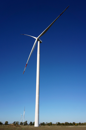Eco power, wind turbines with blue sky. wind turbine for alternative electricity.renewable electric farm with sustainable eco-friendly technology using wind energy rotation for wind turbines renewableの写真素材