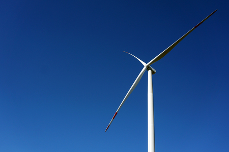 Eco power, wind turbines with blue sky. wind turbine for alternative electricity.renewable electric farm with sustainable eco-friendly technology using wind energy rotation for wind turbines renewableの写真素材