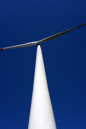 Eco power, wind turbines with blue sky. wind turbine for alternative electricity.renewable electric farm with sustainable eco-friendly technology using wind energy rotation for wind turbines renewableの写真素材