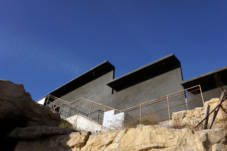 A wall of prefabricated concrete against a blue sky with open space - Imageの写真素材