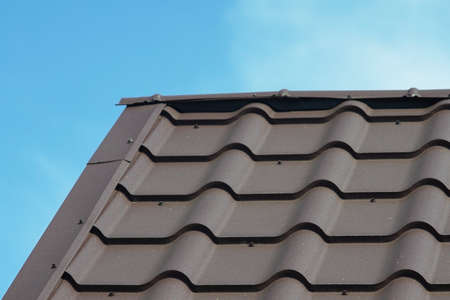 Metal tile roof of gray color.の写真素材