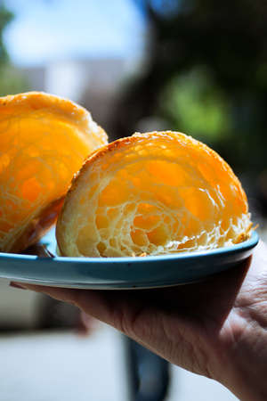Cutaway Fresh homemade unfilled croissants for breakfast with city background. Verticalの写真素材
