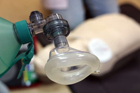 Using a Breathing bag (Ambu) by a student on a simulation dummy during basic life support with an automatic external defibrillator. Simulation training scenarioの写真素材