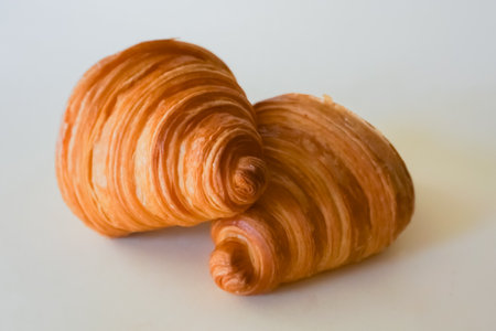 Two french Delicious croissants isolated. Freshly baked pastriesの写真素材