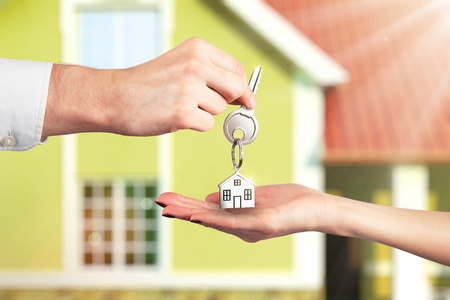 Handing Over the Key from a New Homeの写真素材