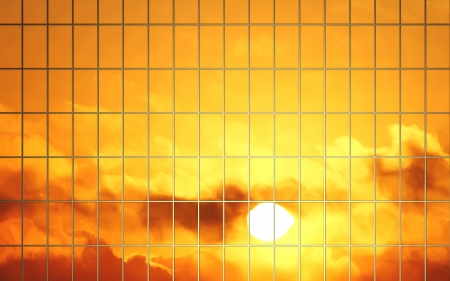 sun reflection in glass wall of skyscraperの写真素材