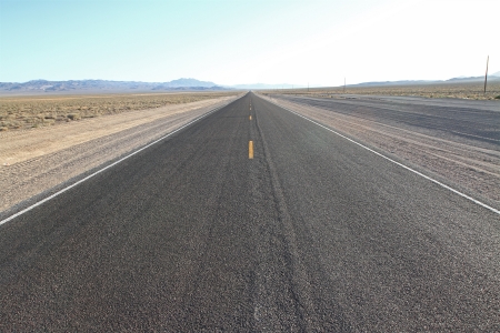 Road Trip on infinite roads through the wildernessの写真素材