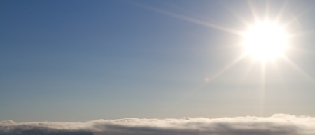 beauvtiful shining sun over cloudscapeの写真素材