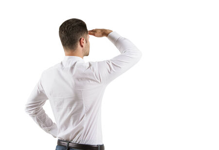 young man looking, isolated on gray  backgroundの写真素材