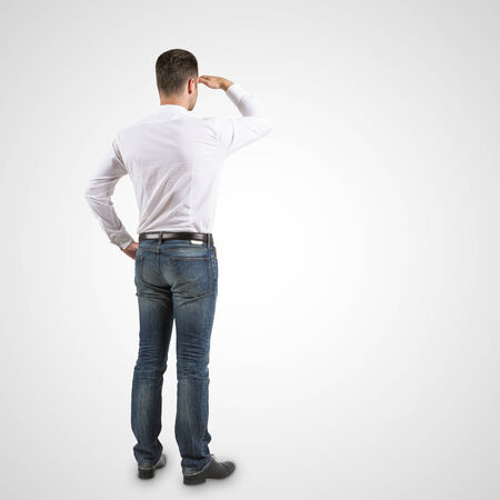 handsome man standing and looking on a white backgroundの写真素材