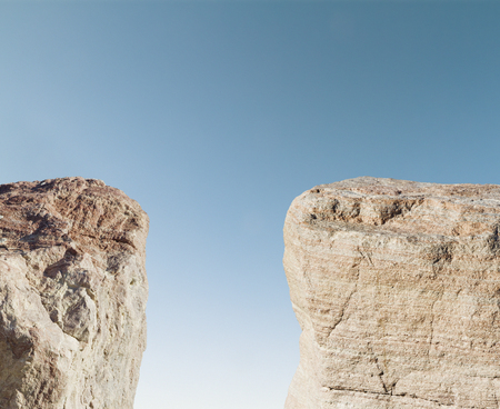 two mountains on a blue sky backgroundの写真素材