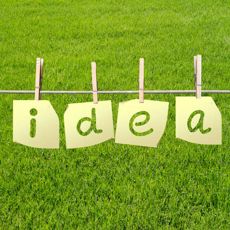 idea word written on sheets of paper on field backgroundの写真素材