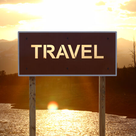 travel road sign on a ocean backgroundの写真素材