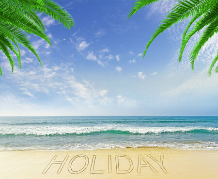 beautiful beach with drawing holiday on sandの写真素材