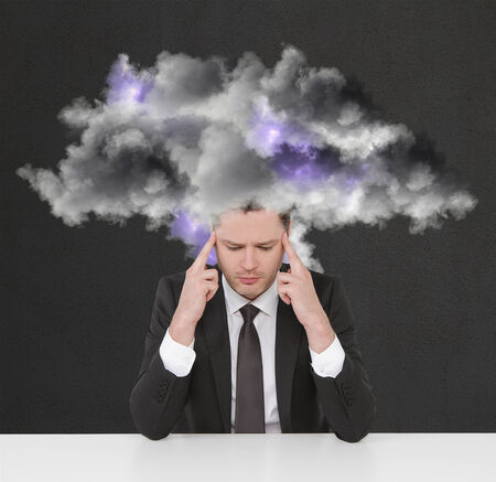 businessman thinking with storm cloudの写真素材
