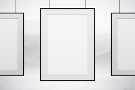 three blank frame hanging on white backgroundの写真素材