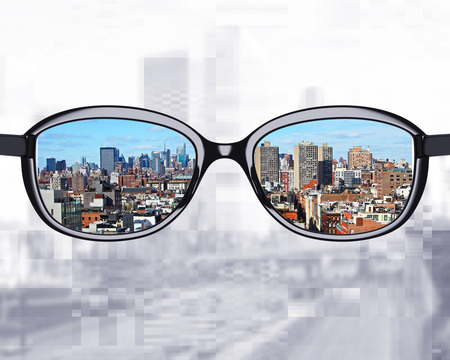 black glasses looking to modern cityの写真素材