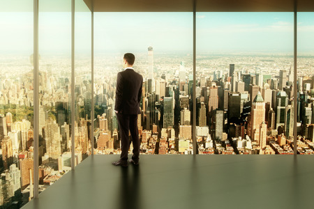 businessman in modern office with a view of the city