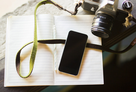 cell phone, diary and old photo cameraの写真素材
