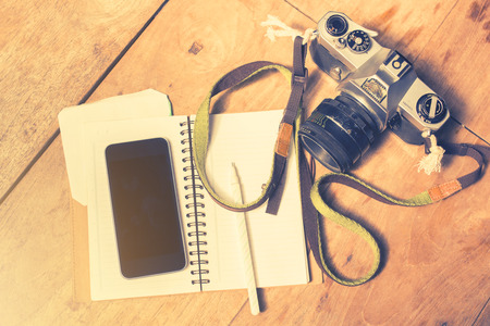 cell phone, diary and old cameraの写真素材