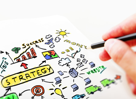 Businessman drawing in a notebook business Plan