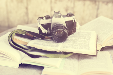 Old photo camera and books, vintage photo effectの写真素材