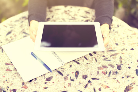 Girl with tablet and exercise bookの写真素材