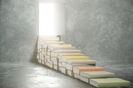 Steps from books into the open doorの写真素材
