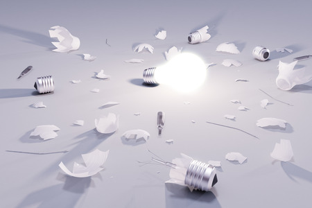 Idea solution concept with glowing lightbulb and broken lightbulbs
