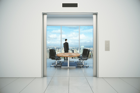 Modern conference room with businessman and city view from the lift entranceの写真素材