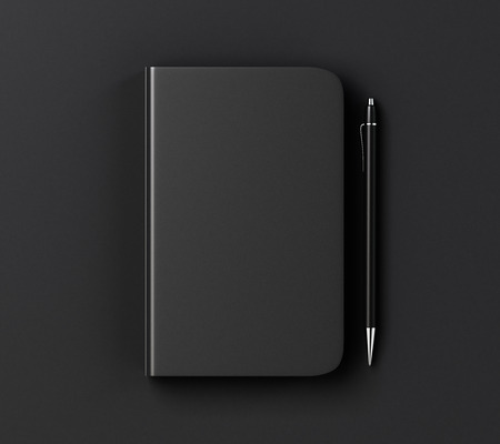Blank black diary cover and pen on black table, mock upの写真素材