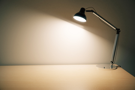 Lightning lamp on empty wooden tableの写真素材