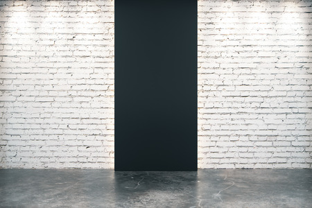Black brick wall opening and concrete floorの写真素材