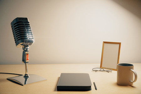Radio microphone with diary, cup of coffe and blank picture frame, mock upの写真素材