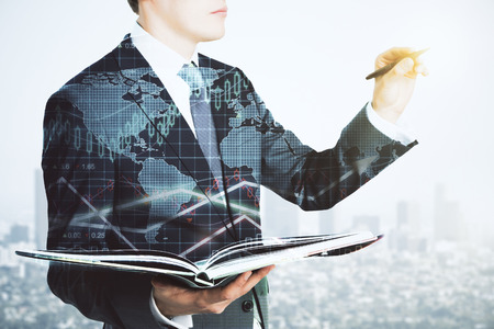 Double explosure with business chart and businessman with book and a penの写真素材